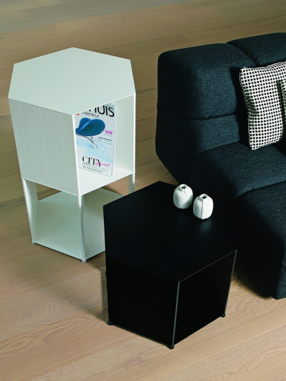 Hexagon freestanding storage pillar by Nendo in Black and White, 36 and 72 cm high. As Side Tables next to a couch.